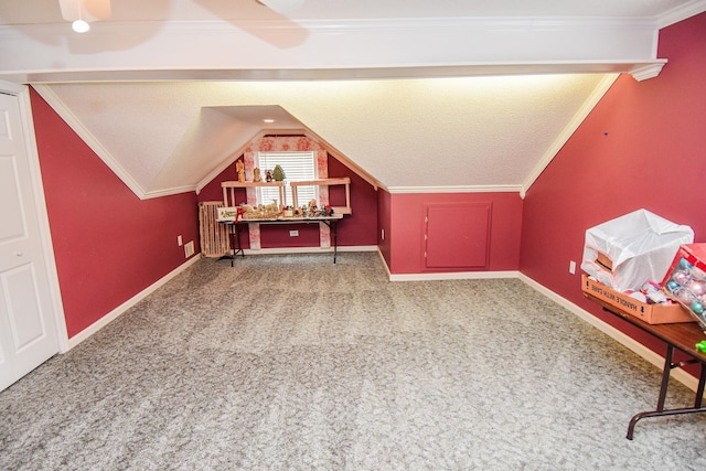 bonus room with lofted ceiling, carpet flooring, and a textured ceiling