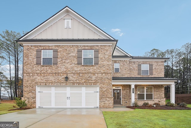 view of front of home featuring a front lawn and a garage