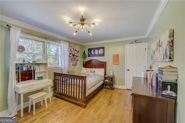 bedroom featuring ornamental molding, light wood-type flooring, and a chandelier