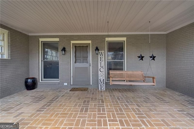 property entrance featuring a porch