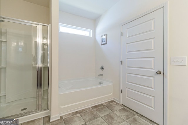 bathroom with separate shower and tub and tile floors