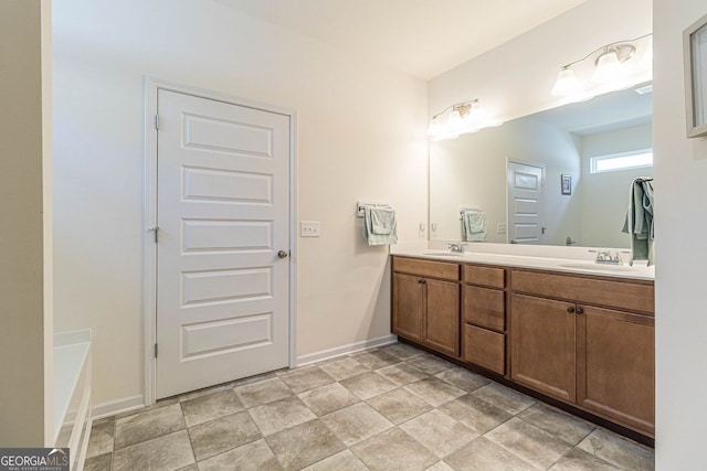 bathroom with double sink, tile flooring, a washtub, and large vanity