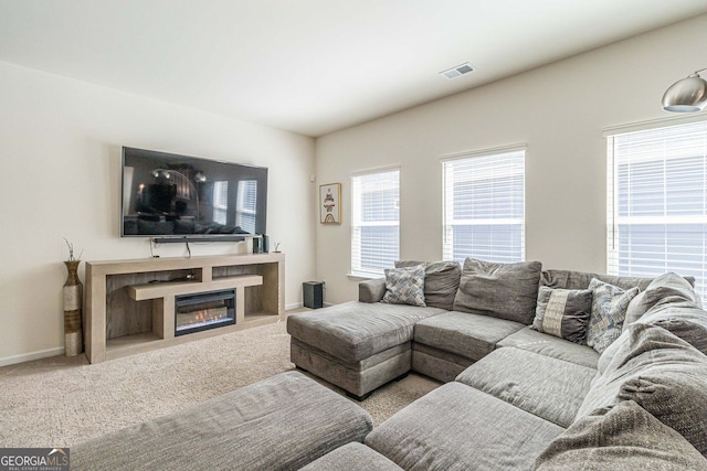 living room featuring light carpet