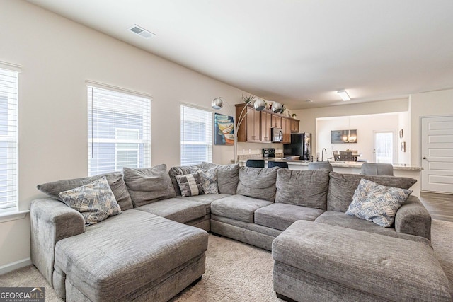 living room with light carpet