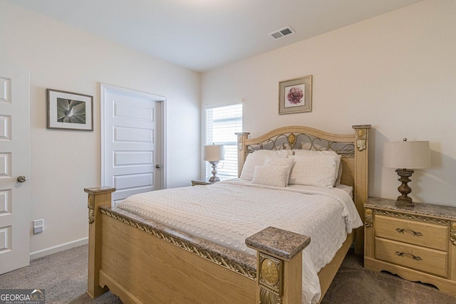 bedroom with dark carpet