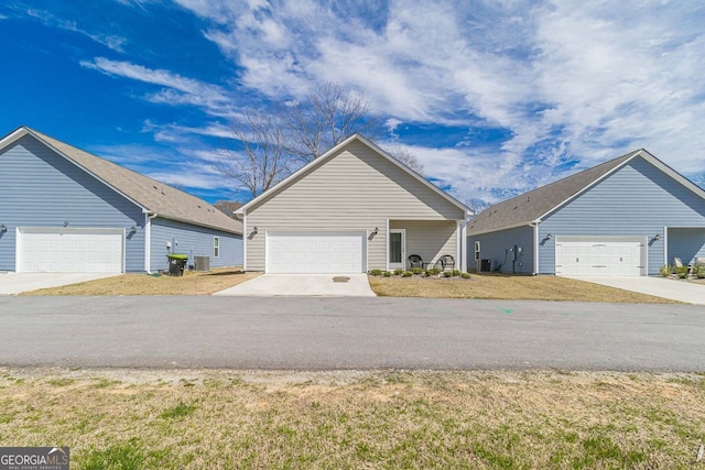 ranch-style house with a front lawn and a garage