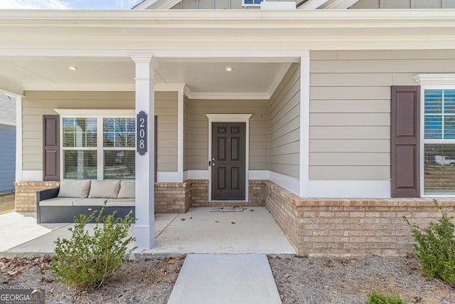 property entrance featuring a porch