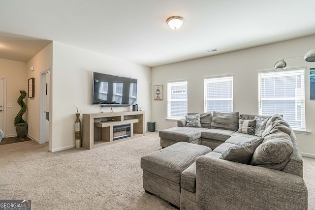 carpeted living room featuring a wealth of natural light