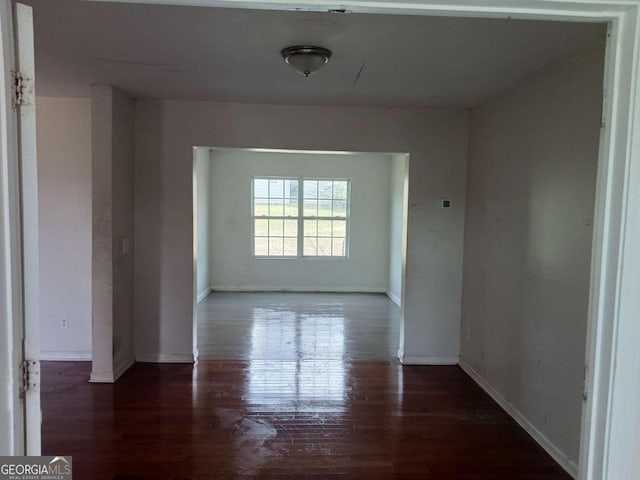 empty room featuring dark hardwood / wood-style floors