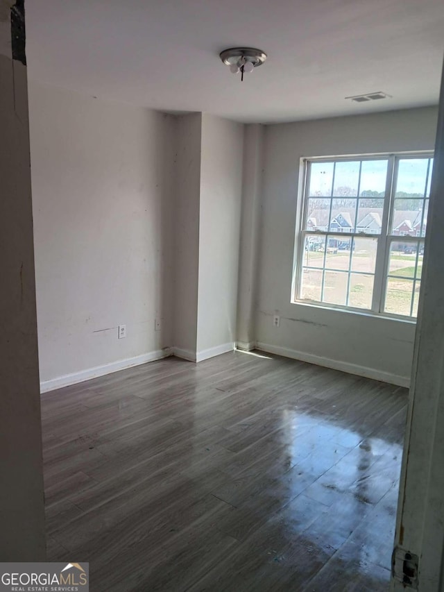 empty room featuring dark hardwood / wood-style floors