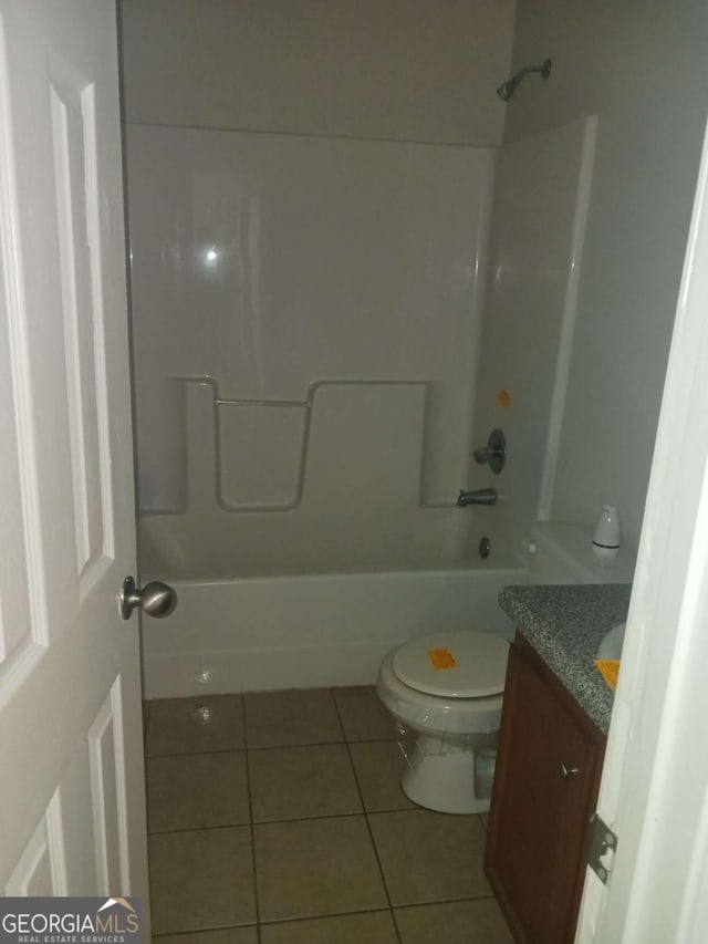 full bathroom with shower / bathing tub combination, toilet, vanity, and tile flooring