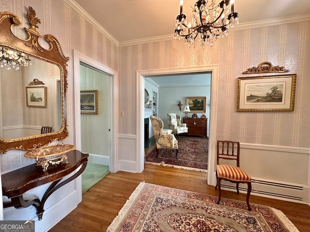 corridor with a notable chandelier, ornamental molding, dark hardwood / wood-style floors, and a baseboard heating unit