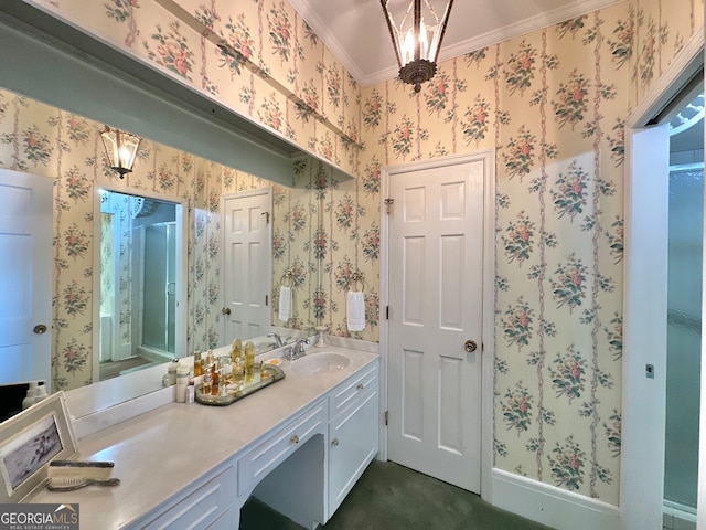 bathroom with ornamental molding and vanity with extensive cabinet space