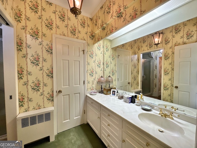 bathroom with radiator heating unit and vanity