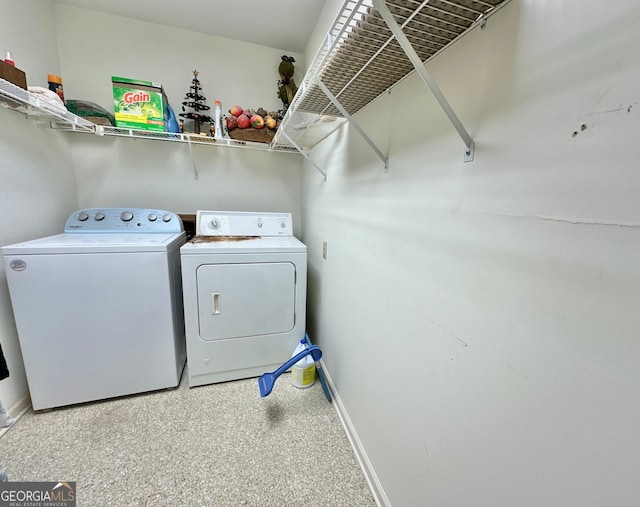 laundry room with independent washer and dryer