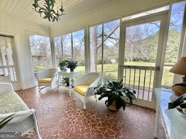 sunroom / solarium featuring plenty of natural light