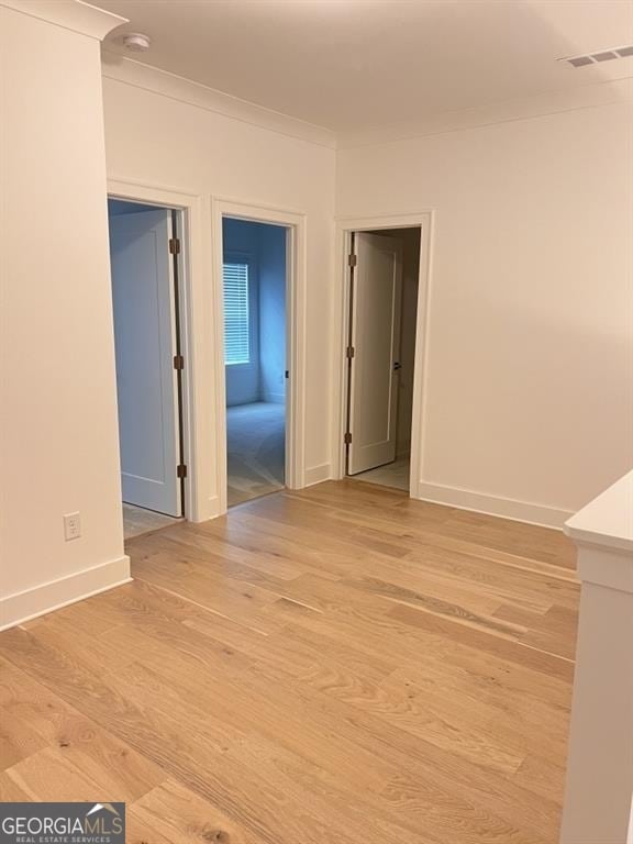 spare room featuring light wood-type flooring