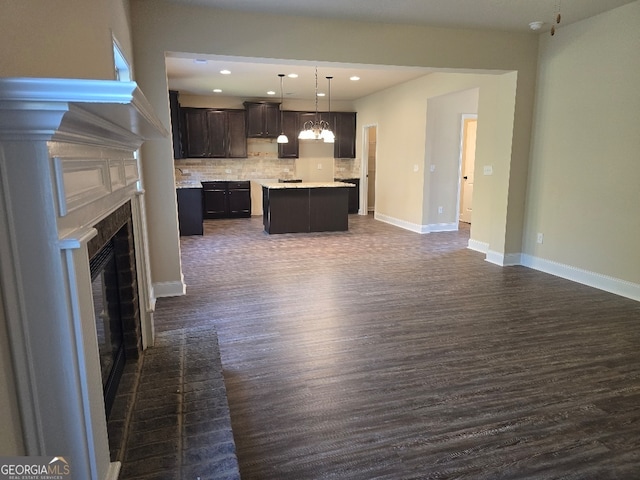 unfurnished living room with dark hardwood / wood-style floors and a fireplace