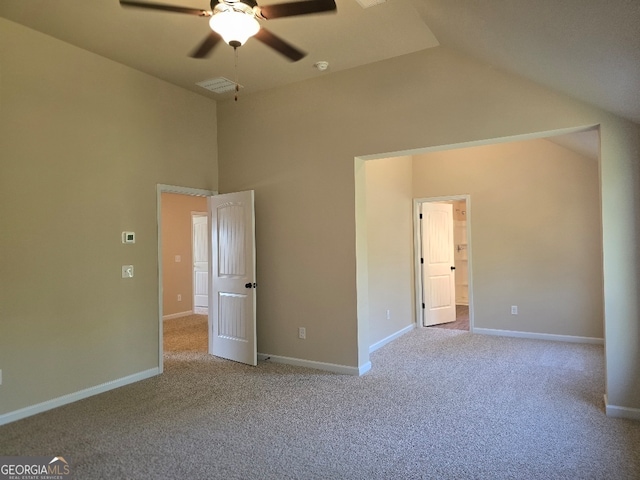 unfurnished bedroom with ceiling fan, light carpet, and vaulted ceiling