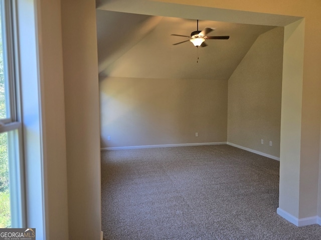 bonus room featuring lofted ceiling, carpet flooring, and ceiling fan