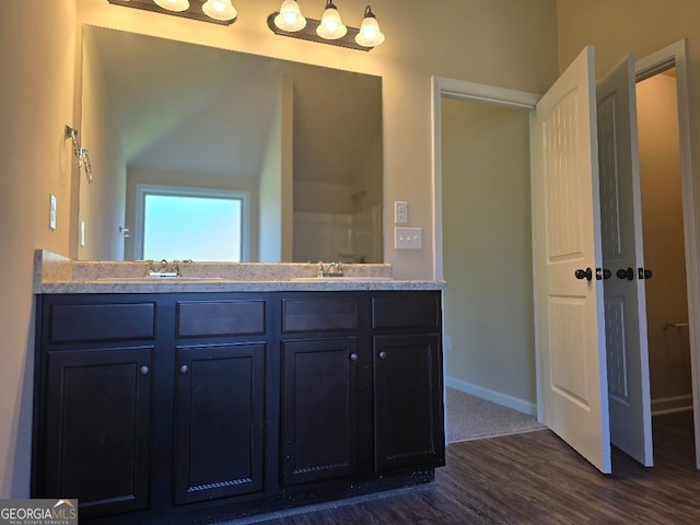 bathroom with wood-type flooring and vanity