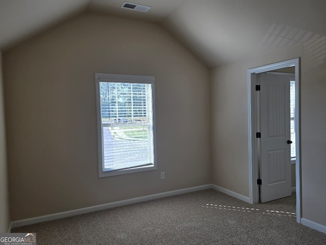 bonus room with carpet flooring and lofted ceiling