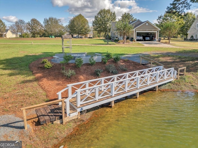 dock area featuring a yard and a water view