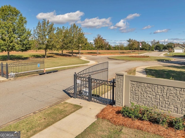 view of property's community featuring a yard