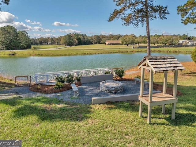 property view of water featuring a fire pit