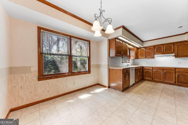 kitchen featuring light tile floors, decorative light fixtures, backsplash, dishwasher, and an inviting chandelier