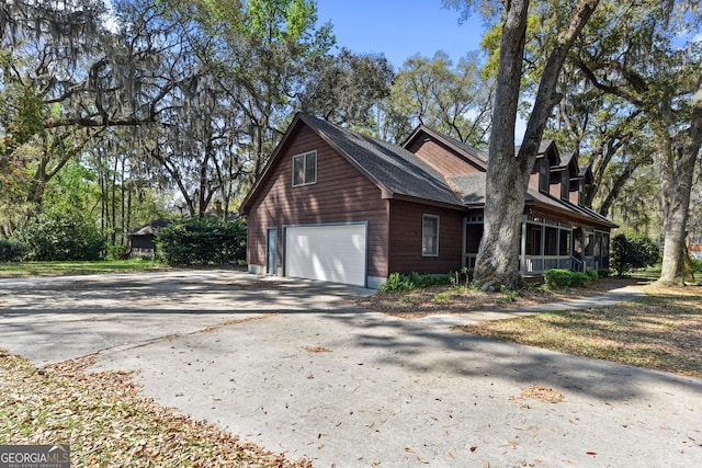 view of side of property featuring a garage