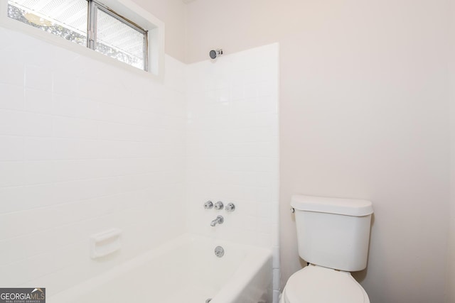 bathroom with toilet and a bathing tub