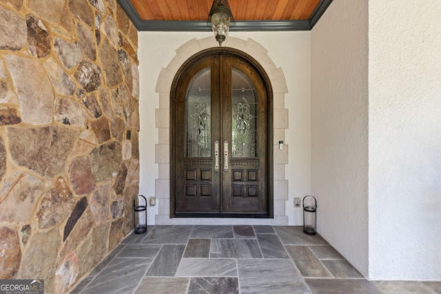 property entrance featuring french doors