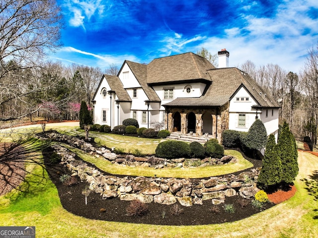 113 Hawks Ct, Ball Ground, GA 30107 - french country home featuring a chimney, stucco siding, stone siding, and a porch