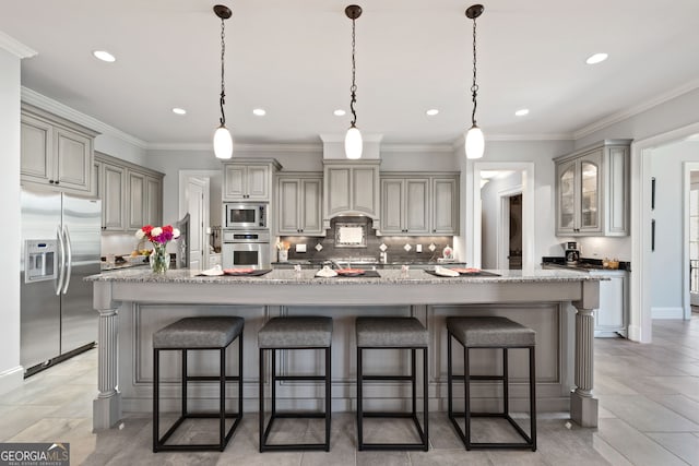 113 Hawks Ct, Ball Ground, GA 30107 - kitchen with stainless steel appliances, backsplash, recessed lighting, a breakfast bar, and decorative light fixtures