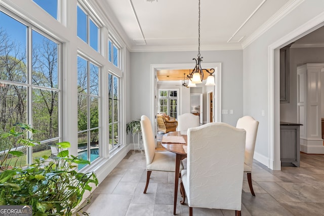 interior space with tile floors, a wealth of natural light, and a chandelier