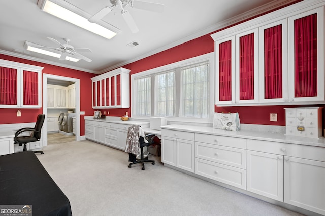 office space featuring ceiling fan, crown molding, and light colored carpet