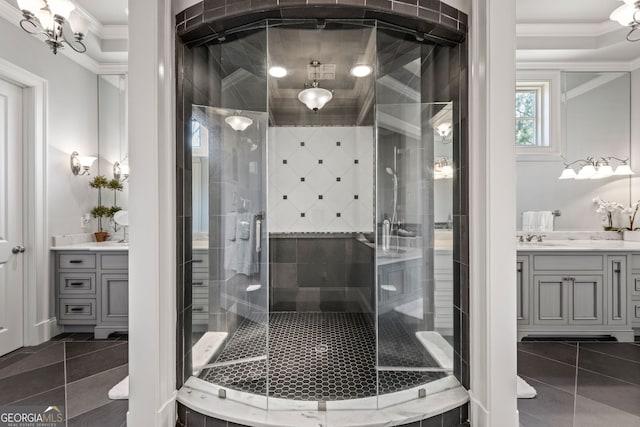 bathroom featuring tile flooring, an enclosed shower, ornamental molding, and vanity