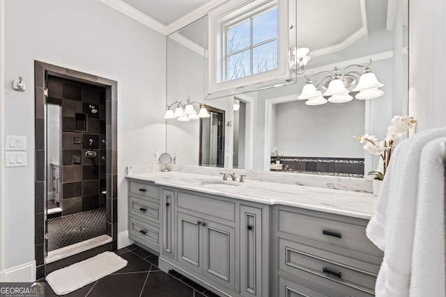 bathroom with a shower with shower door, tile flooring, vanity, and ornamental molding