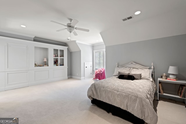 carpeted bedroom with ceiling fan and crown molding