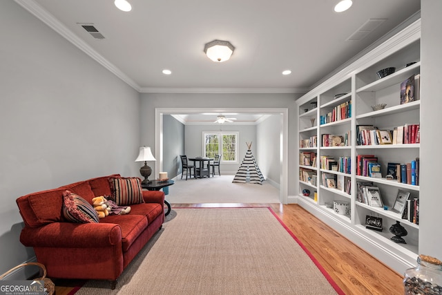 113 Hawks Ct, Ball Ground, GA 30107 - living area with ornamental molding, recessed lighting, a ceiling fan, and wood finished floors