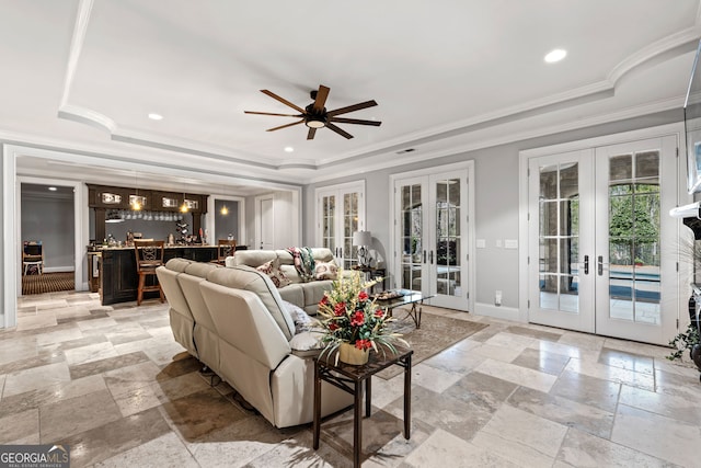 living room with french doors, ceiling fan, light tile floors, and a raised ceiling