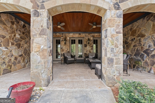 doorway to property with a patio area, french doors, and ceiling fan