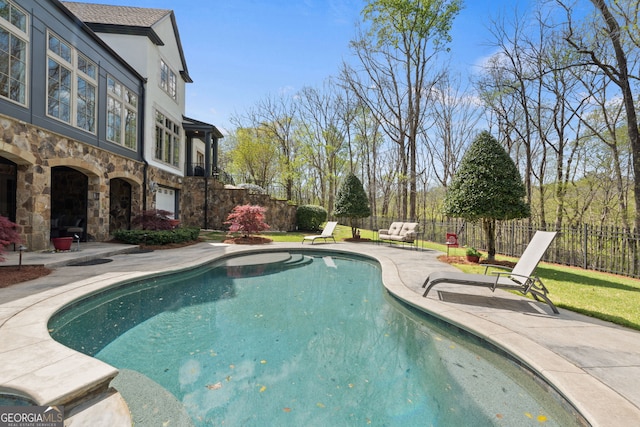 view of pool featuring a patio area