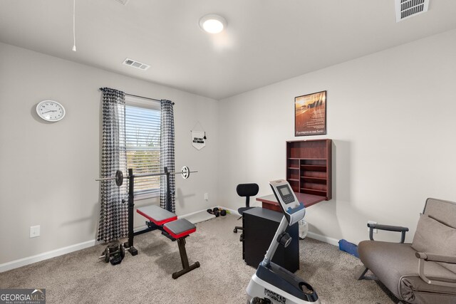 workout room with light colored carpet