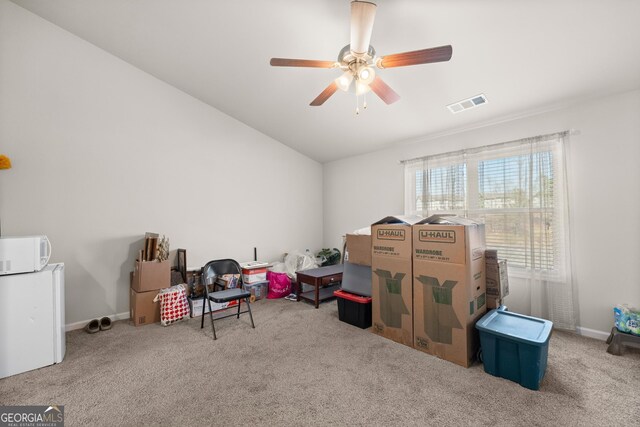 miscellaneous room with lofted ceiling, light colored carpet, and ceiling fan