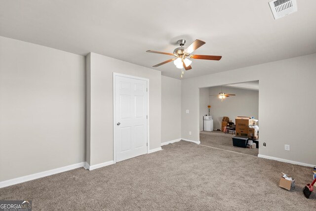 unfurnished bedroom with light carpet and ceiling fan