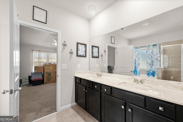 bathroom featuring ceiling fan, tile flooring, and double sink vanity