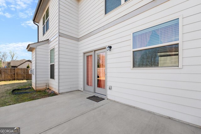 property entrance with a patio