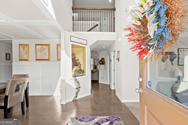 entrance foyer featuring dark hardwood / wood-style floors